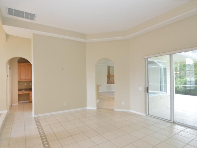 spare room featuring light tile patterned floors