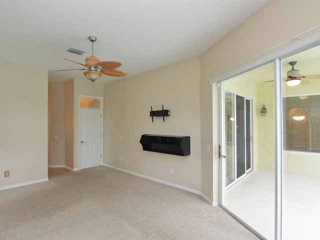 unfurnished living room with light carpet and ceiling fan