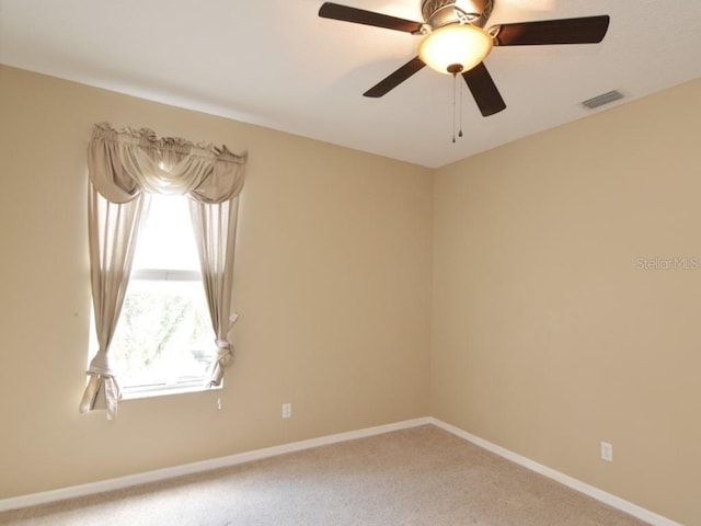 unfurnished room featuring carpet and ceiling fan