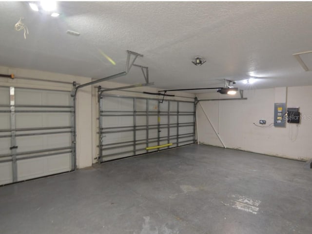 garage featuring a garage door opener and electric panel