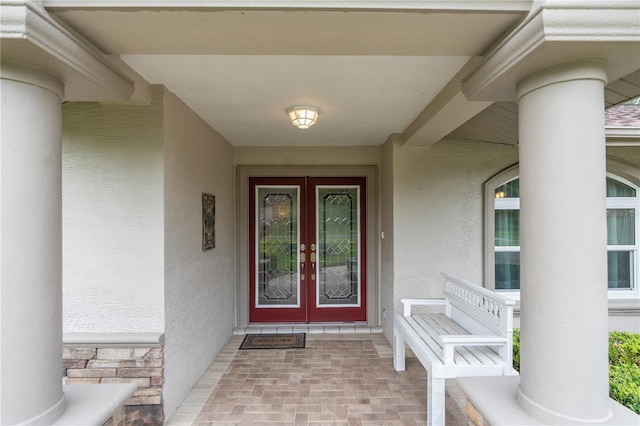 view of exterior entry featuring a porch