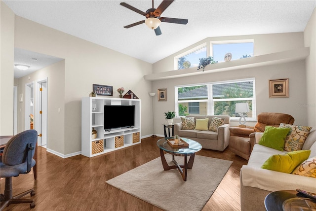 living room featuring ceiling fan, hardwood / wood-style flooring, a textured ceiling, and high vaulted ceiling