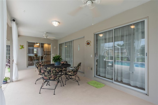 sunroom / solarium with ceiling fan and a wealth of natural light