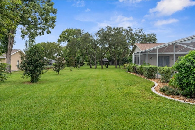 view of yard featuring a lanai