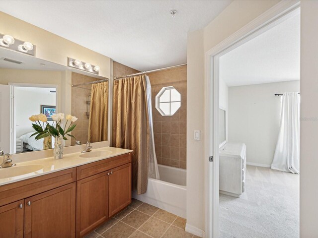 bathroom featuring double vanity, tile patterned floors, and shower / bathtub combination with curtain