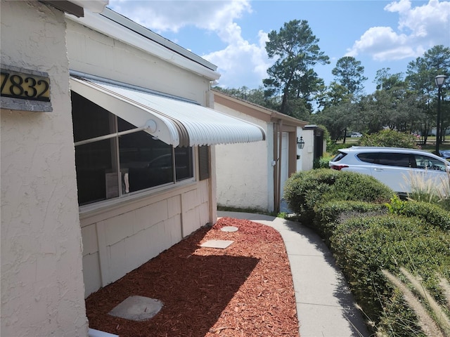 view of home's exterior with stucco siding