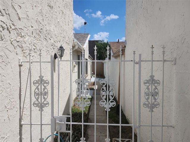 view of gate with fence