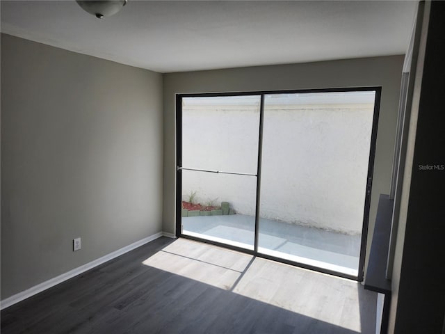 unfurnished room featuring hardwood / wood-style flooring