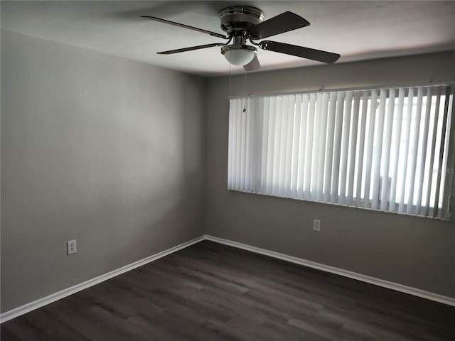 empty room featuring ceiling fan and hardwood / wood-style flooring