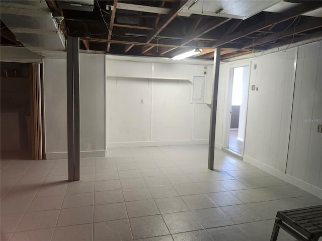 basement featuring light tile patterned floors