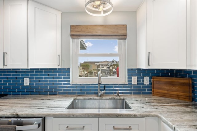 kitchen with white cabinets and decorative backsplash