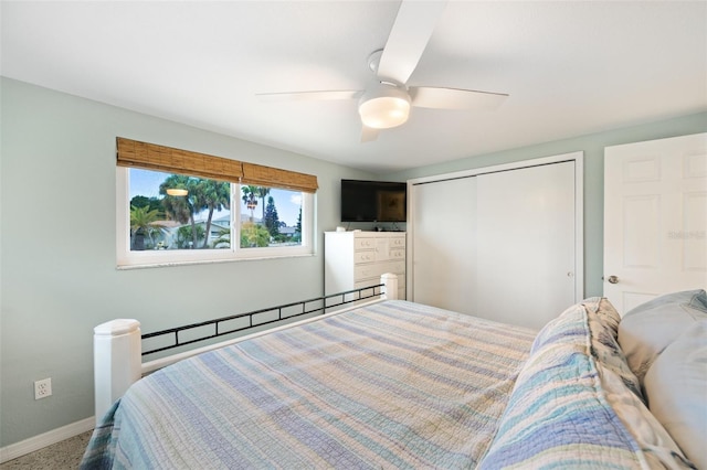 bedroom featuring a closet, ceiling fan, carpet floors, and a baseboard radiator