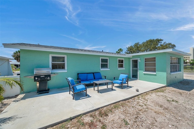 rear view of house with a patio and an outdoor hangout area