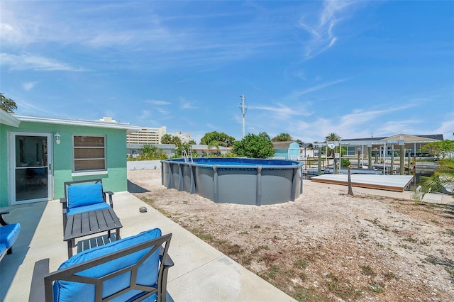 view of swimming pool with a patio