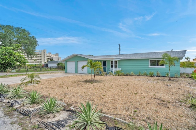 single story home with a garage