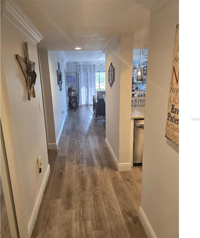 hallway with dark wood-type flooring and a textured ceiling