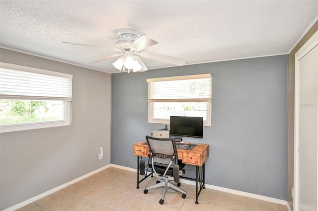 office with a ceiling fan, a textured ceiling, baseboards, and light tile patterned floors