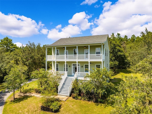 view of front of home featuring ceiling fan and a porch