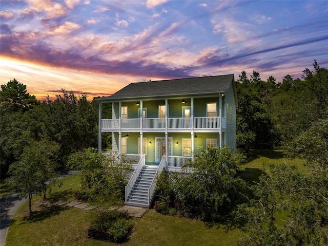 view of front of home with a balcony and covered porch