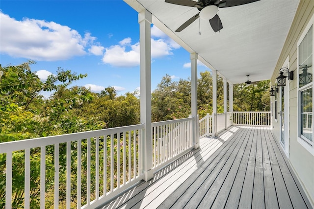 wooden deck featuring ceiling fan