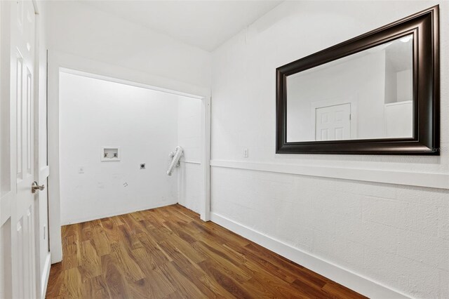 laundry area featuring hardwood / wood-style floors, hookup for a washing machine, and hookup for an electric dryer