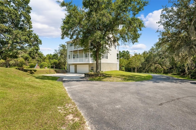 view of front of house with a garage and a front yard