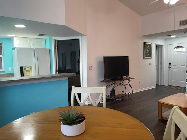 dining room with dark hardwood / wood-style flooring