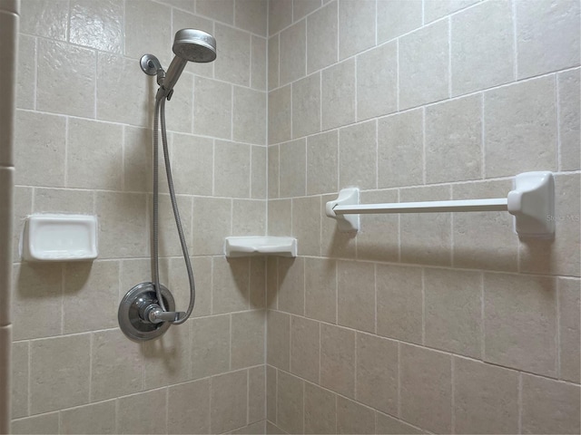 bathroom with a tile shower