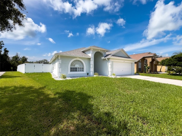 view of front facade with a garage and a front yard