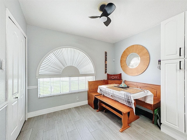 bedroom featuring ceiling fan, baseboards, and light wood-style flooring