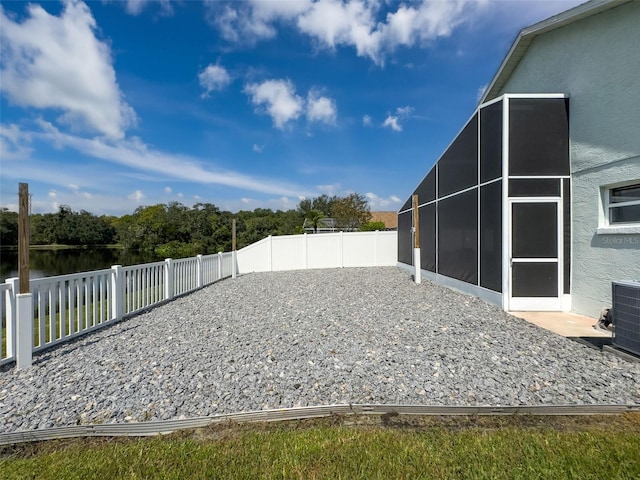 view of yard with cooling unit and a fenced backyard