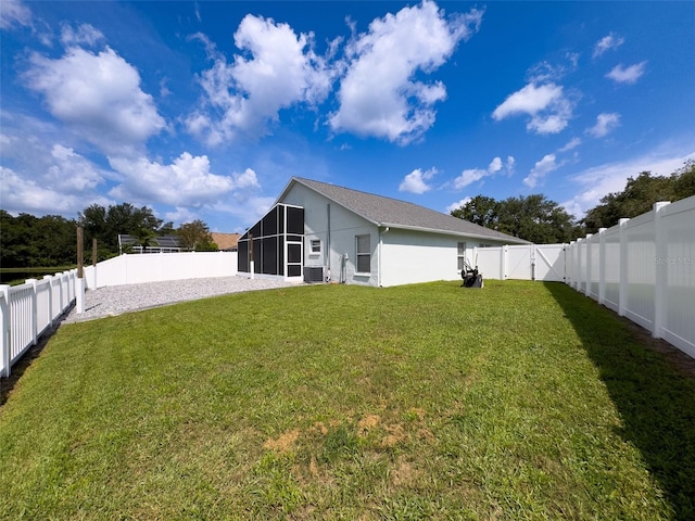 view of yard featuring a sunroom