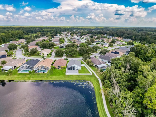 drone / aerial view featuring a water view and a residential view