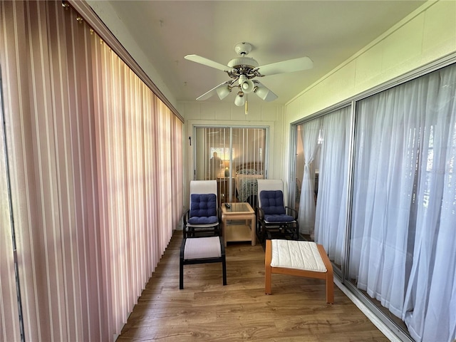 sitting room featuring hardwood / wood-style flooring and ceiling fan