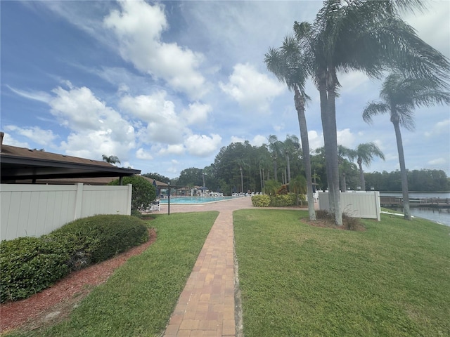 view of yard featuring a fenced in pool