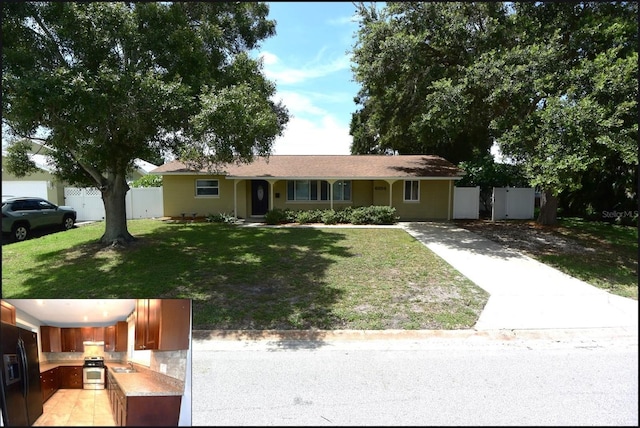 single story home featuring sink and a front lawn