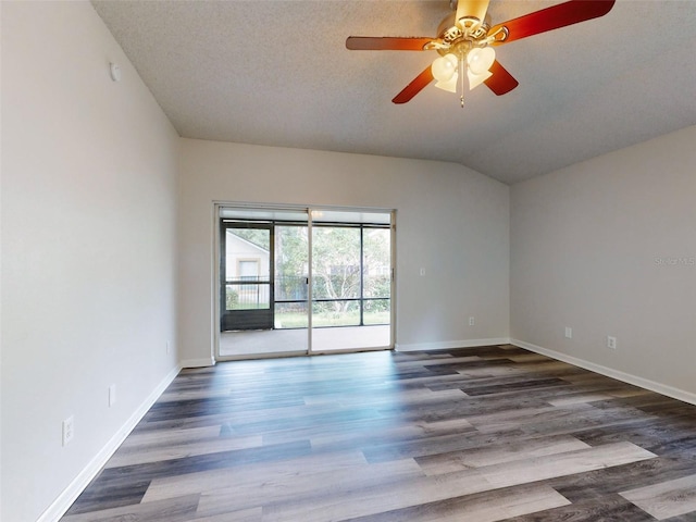 unfurnished room featuring lofted ceiling, ceiling fan, hardwood / wood-style flooring, and a textured ceiling