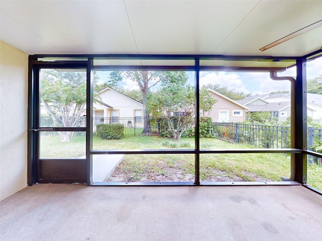 unfurnished sunroom featuring a wealth of natural light