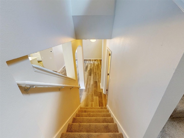 stairway featuring hardwood / wood-style flooring