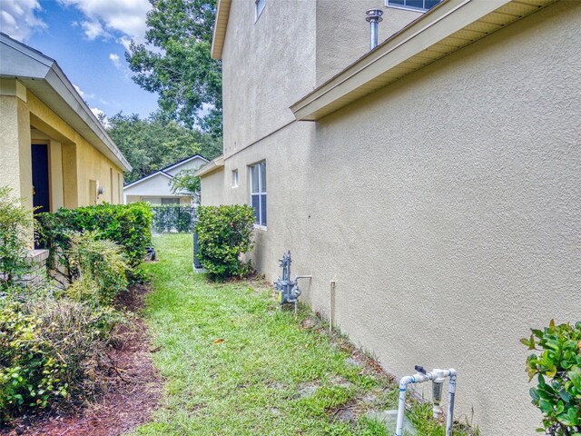 view of property exterior featuring a yard