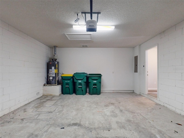 garage featuring a garage door opener, water heater, and electric panel