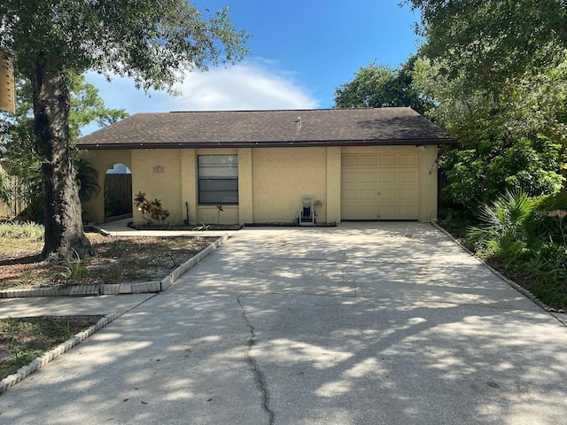 ranch-style house featuring a garage