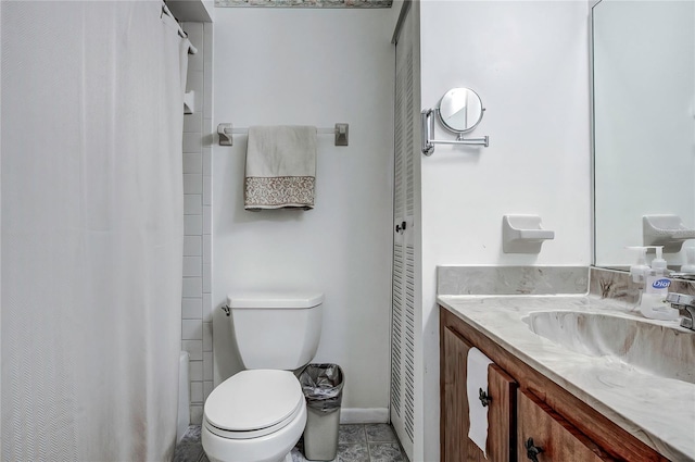 bathroom with vanity, toilet, a shower with shower curtain, and tile patterned flooring