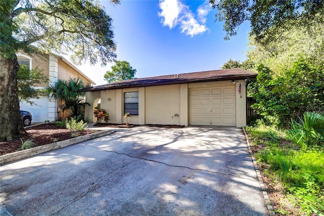 single story home featuring a garage