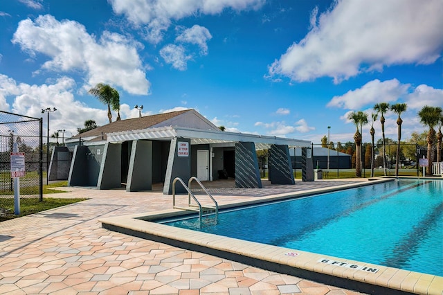 view of swimming pool with a patio area