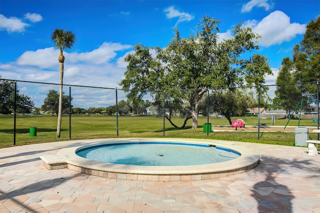 view of pool featuring a yard