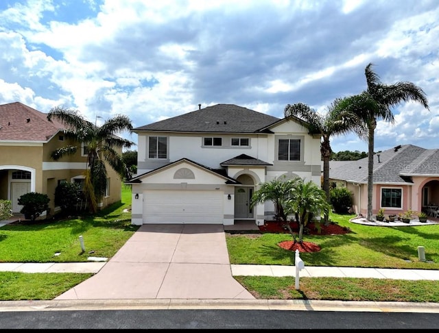 front facade featuring a front yard and a garage