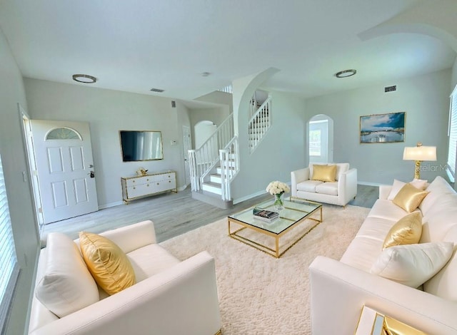 living room with light hardwood / wood-style flooring