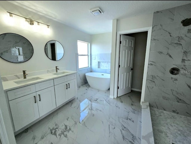 bathroom with shower with separate bathtub, a textured ceiling, tile patterned flooring, and vanity