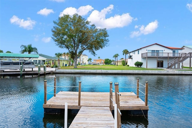 dock area with a water view and a residential view